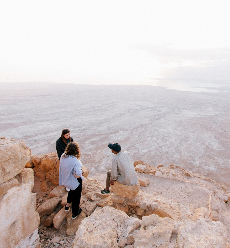 Personal Coaching and Therapy Personal Coaching and Therapy with 3 people sitting on rocks looking out over beach to the ocean horizon
