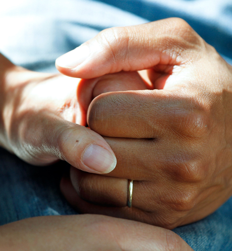 critical-incident Critical Incident with two people holding hands in a supportive manner